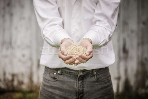 Farmer Showing Animal Dry Food Stock photo © aetb