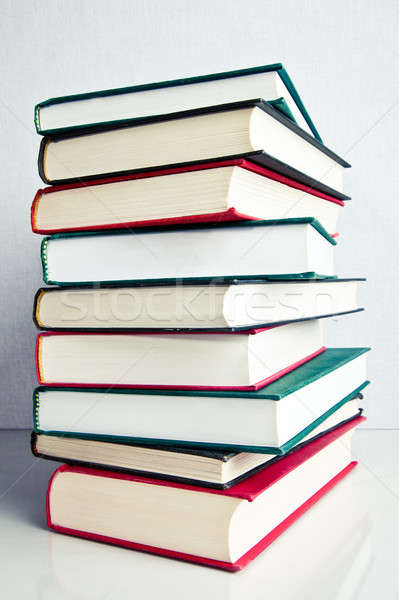 Stack of books on white reflective surface Stock photo © aetb