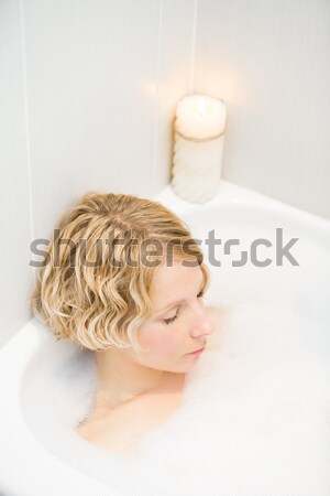 Young woman relaxing in the bath Stock photo © aetb