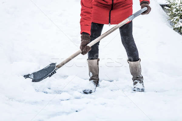 Close-up of Woman Shoveling her Parking lot Stock photo © aetb