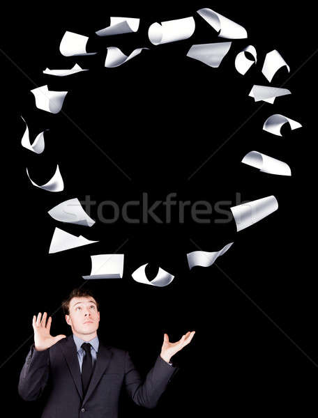 Businessman manipulating sheets of paper Stock photo © aetb
