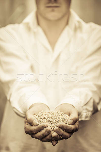 Farmer Showing Animal Dry Food Stock photo © aetb