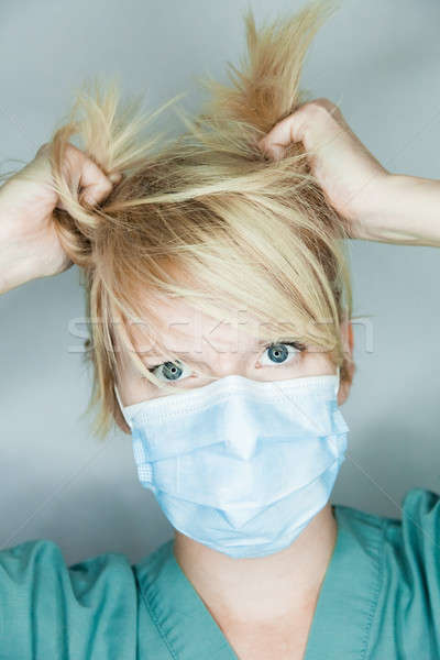 Crazy Nurse Pulling Hairs
 Stock photo © aetb