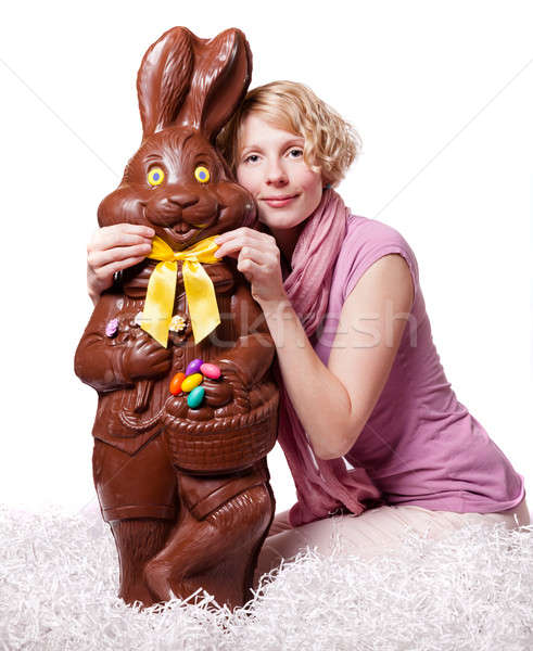 Blond Girl Adjusting Bowtie of a Chocolate Easter Bunny Stock photo © aetb