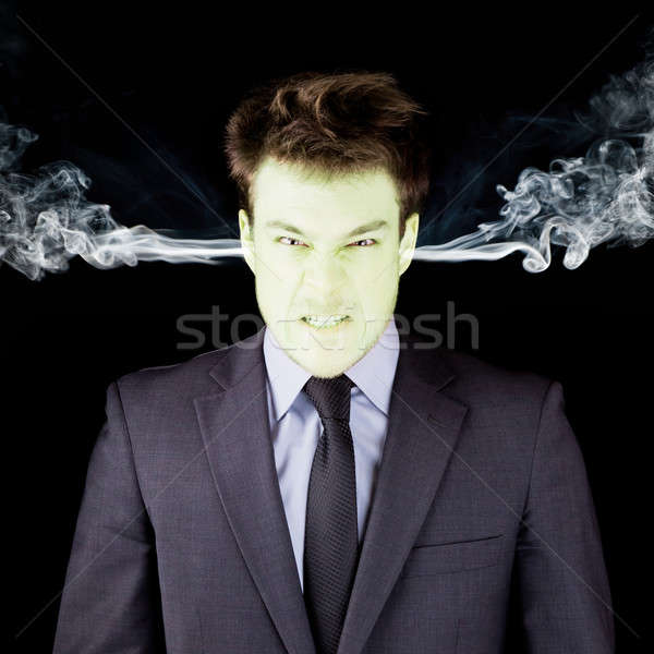 Furious businessman getting green face Stock photo © aetb