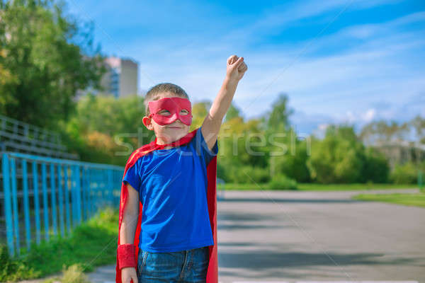 Superhero stałego stadion wzywając naprzód chłopca Zdjęcia stock © Agatalina