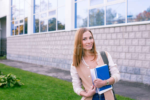Student standing on building background Stock photo © Agatalina