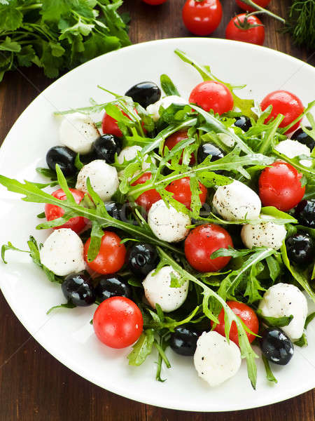 Salata taze kiraz domates mozzarella siyah zeytin sığ Stok fotoğraf © AGfoto