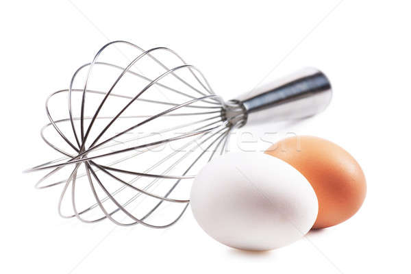 Eggs and whisk Stock photo © AGorohov
