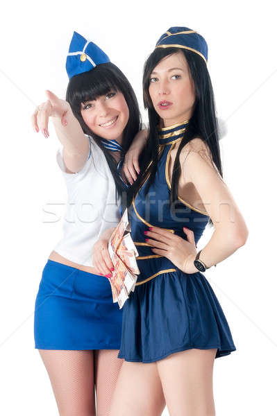 Two pretty stewardess with money Stock photo © Aikon