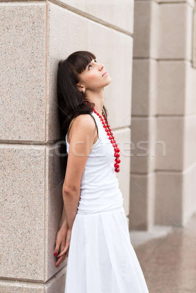 Attractive sad girl with red beads Stock photo © Aikon