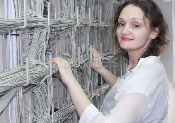 Woman working on telecommunication equipment Stock photo © Aikon