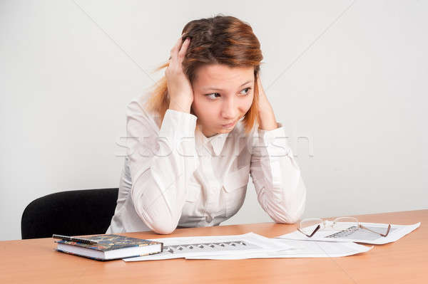 Young attractive student worried over charts Stock photo © Aikon