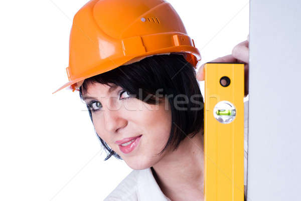 Woman in helmet with level Stock photo © Aikon