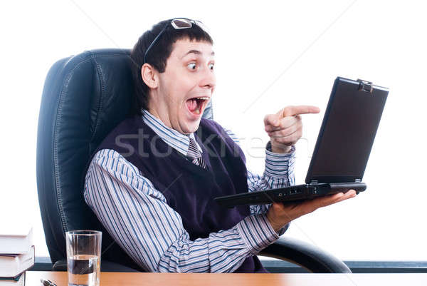 Young businessman with laptop Stock photo © Aikon