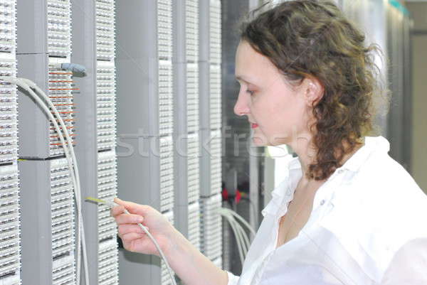 Woman working on telecommunication equipment Stock photo © Aikon