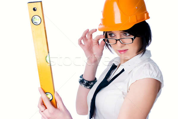 Pretty girl with measuring level Stock photo © Aikon