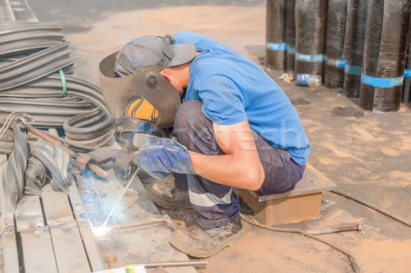 industrial worker welder during working process Stock photo © Aikon