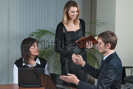 businessman congratulate young businesswoman Stock photo © Aikon