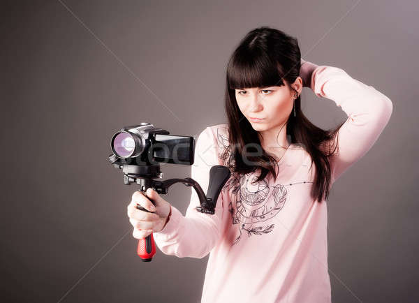young woman with video camera Stock photo © Aikon