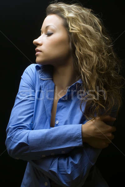 Attractive brunette woman in blue shirt Stock photo © Aikon