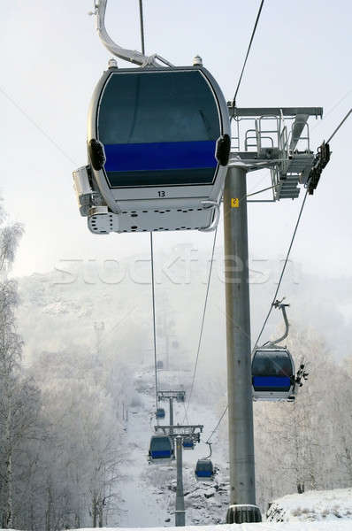 Blue cabin lifts at a ski resort Stock photo © Aikon