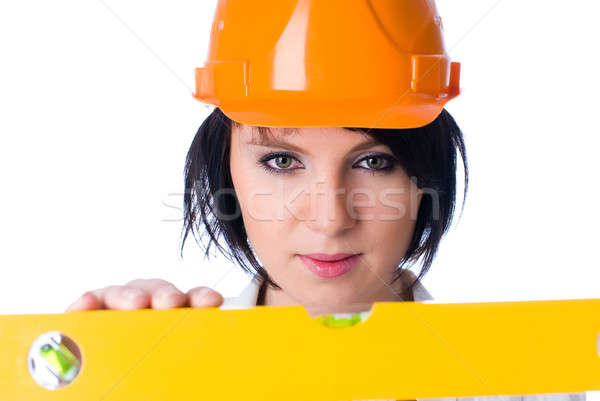 Attractive woman with measuring level Stock photo © Aikon