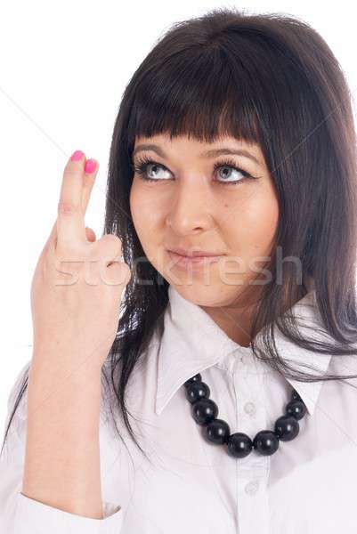 Pretty girl with crossed fingers Stock photo © Aikon
