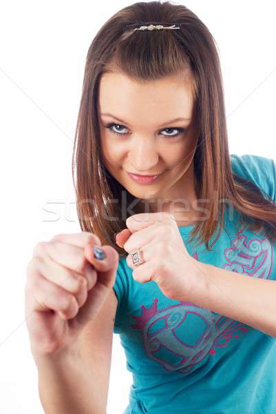 Pretty girl defends with smile Stock photo © Aikon
