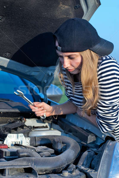 Stock photo: Young Blond Woman With Her Broken Car