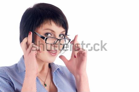 Attractive smiling girl with hands in hair Stock photo © Aikon