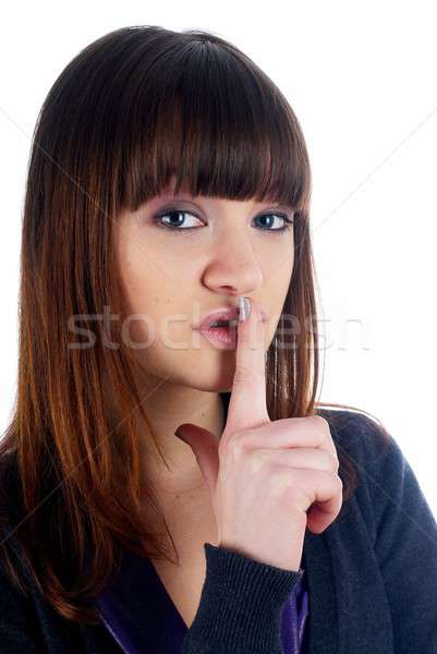 Stock photo: Woman gesturing to silence