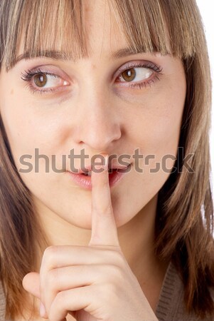 Attractive woman with finger on lips Stock photo © Aikon