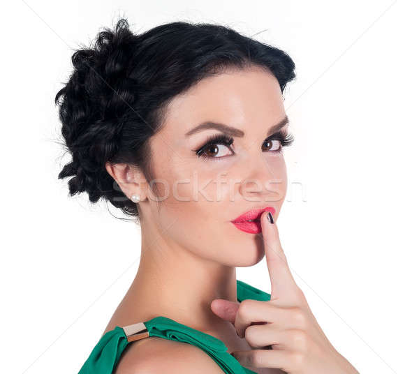 Pretty woman making a keep it quiet gesture Stock photo © Aikon