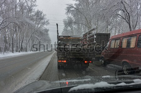 Stock photo: Long truck drifton the winter road