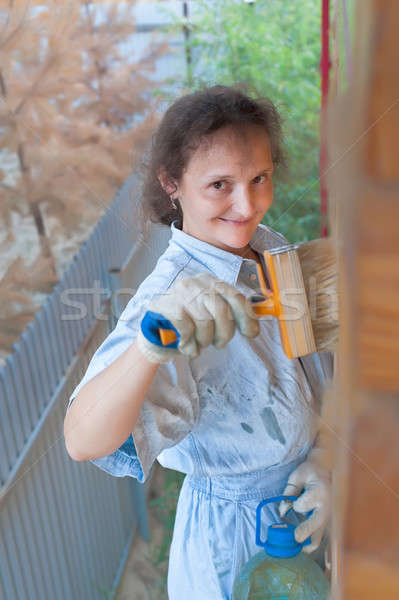 Pretty woman painting her house Stock photo © Aikon