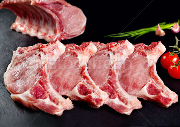 Fresh and raw meat. Ribs and pork chops uncooked , with cuts ready to grill and barbecue Stock photo © Ainat