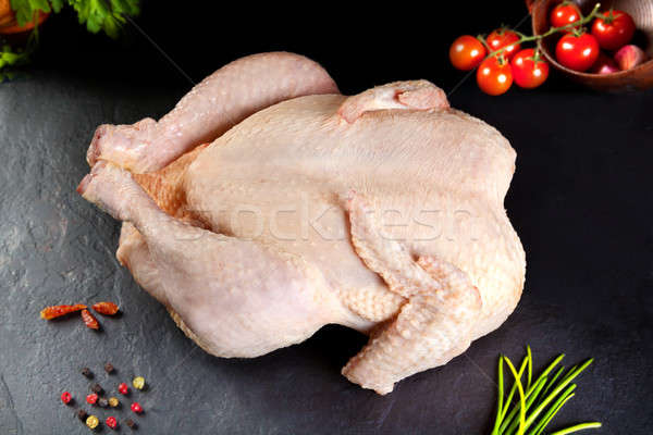 Food and feed. raw meat. uncooked poultry chicken to grilled or barbecue Stock photo © Ainat