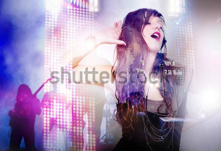 Schöne Frau Musik hören Kopfhörer Bühne Beleuchtung leben Stock foto © Ainat