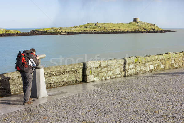 man looking to Dalkey island by binoculars Stock photo © Aitormmfoto