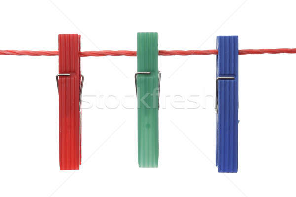 Birincil renkler üç plastik clothespin Stok fotoğraf © Aitormmfoto