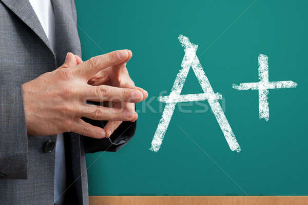 Wynik motywacja nauczyciel ręce tablicy Fotografia Zdjęcia stock © ajfilgud