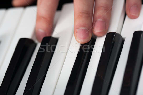 Piano playing Stock photo © ajfilgud