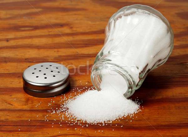 Salt shaker on wooden table Stock photo © ajt