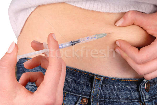Ensülin enjeksiyon genç kız şırınga el tıp Stok fotoğraf © ajt