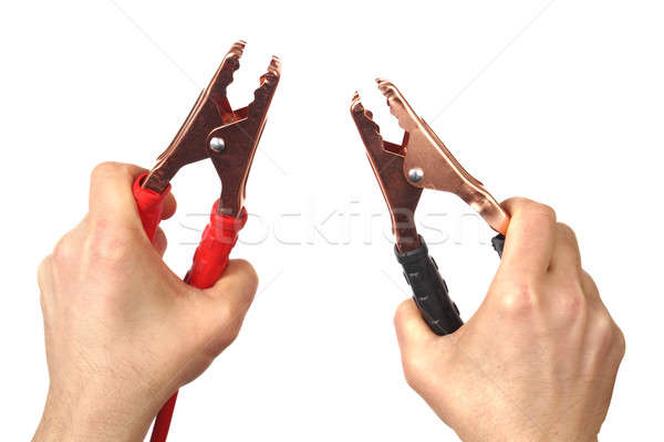 Hands with jumper cables on white Stock photo © ajt
