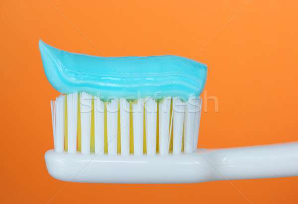 Brosse à dents dentifrice orange sourire bouche dents [[stock_photo]] © ajt