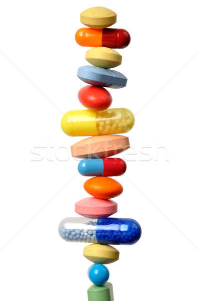 Stock photo: Stack of pills and capsules