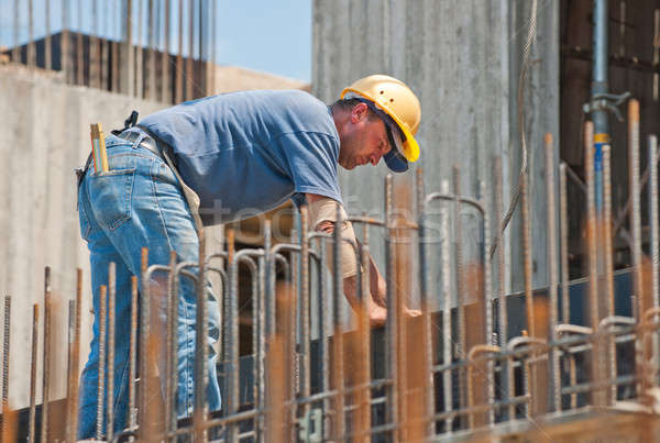 Construction worker busy with forwork frames Stock photo © akarelias