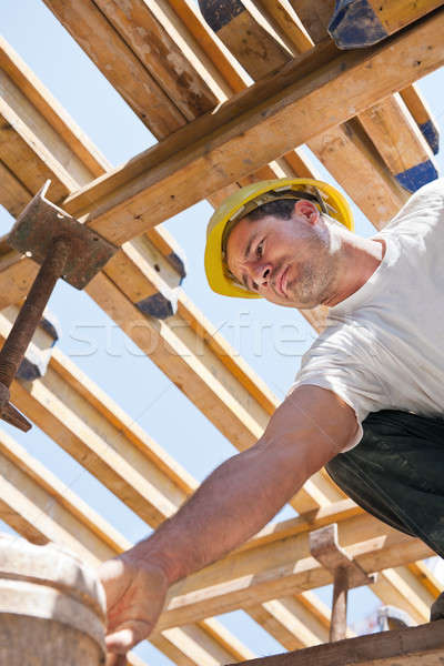 Construction worker under formwork girders Stock photo © akarelias